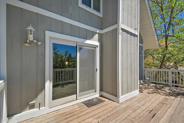 a view of a house with a tree in the background
