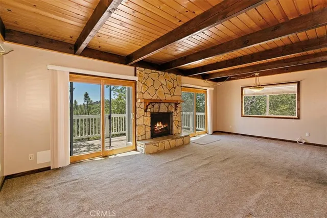 a view of an empty room with a fireplace