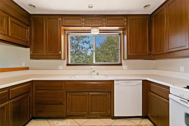 a kitchen with a sink and a window