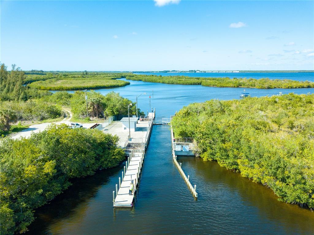 8064 Welsford Road Port Charlotte, FL 33981 - Photo 4 of 8 a view of a lake with a big yard