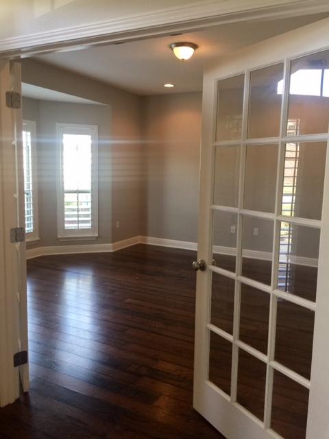 43 Secret Street Freeport, FL 32439 - Photo 23 of 77 a view of empty room with wooden floor and fan