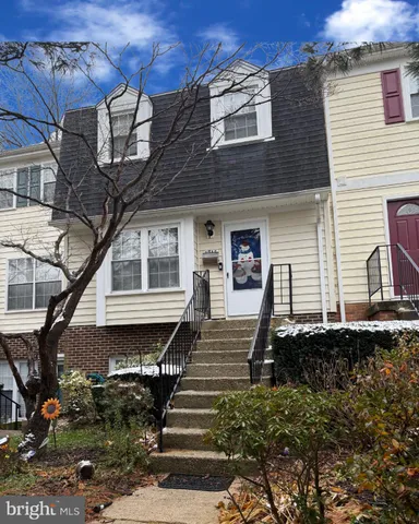 a front view of a house with stairs