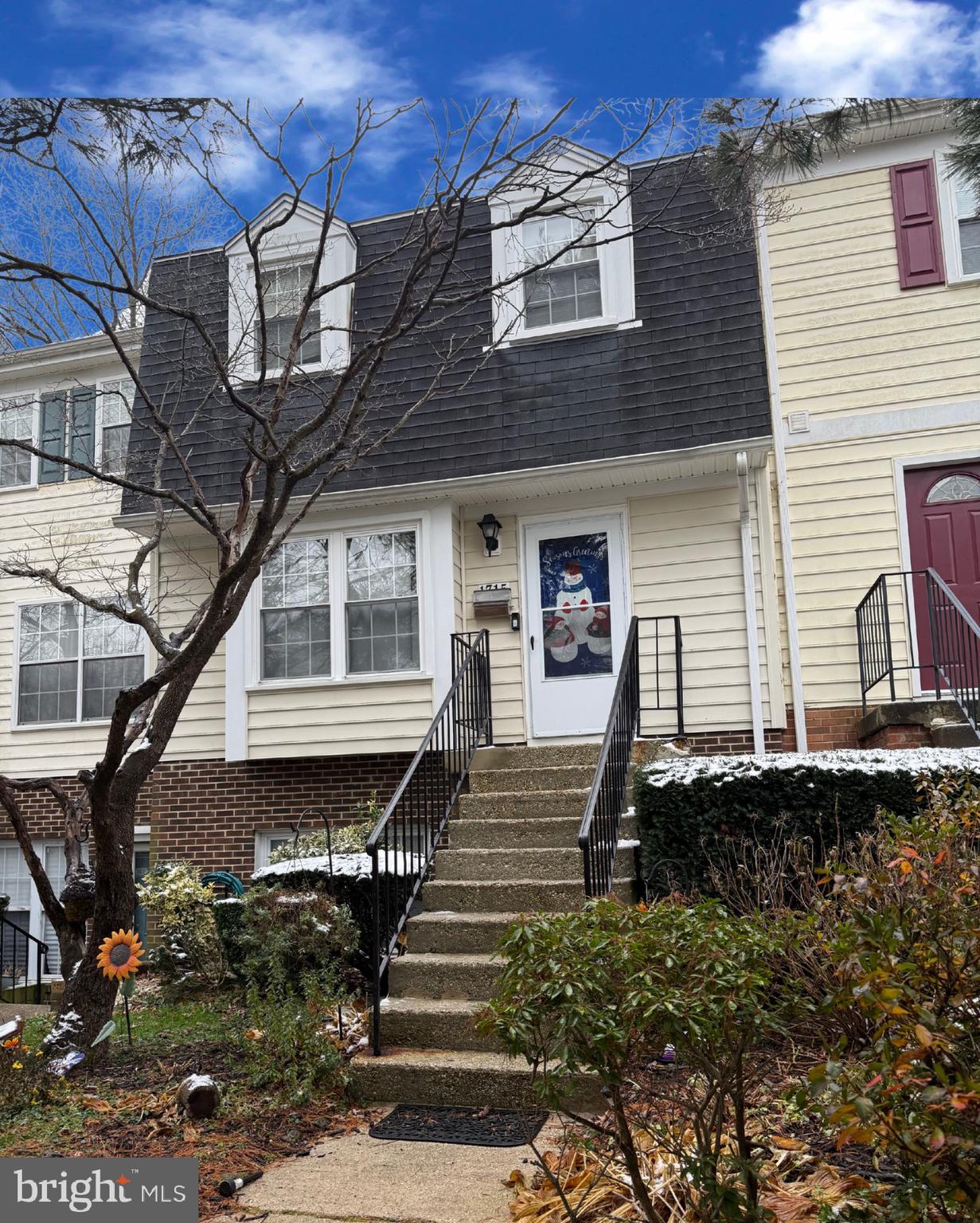 a front view of a house with stairs