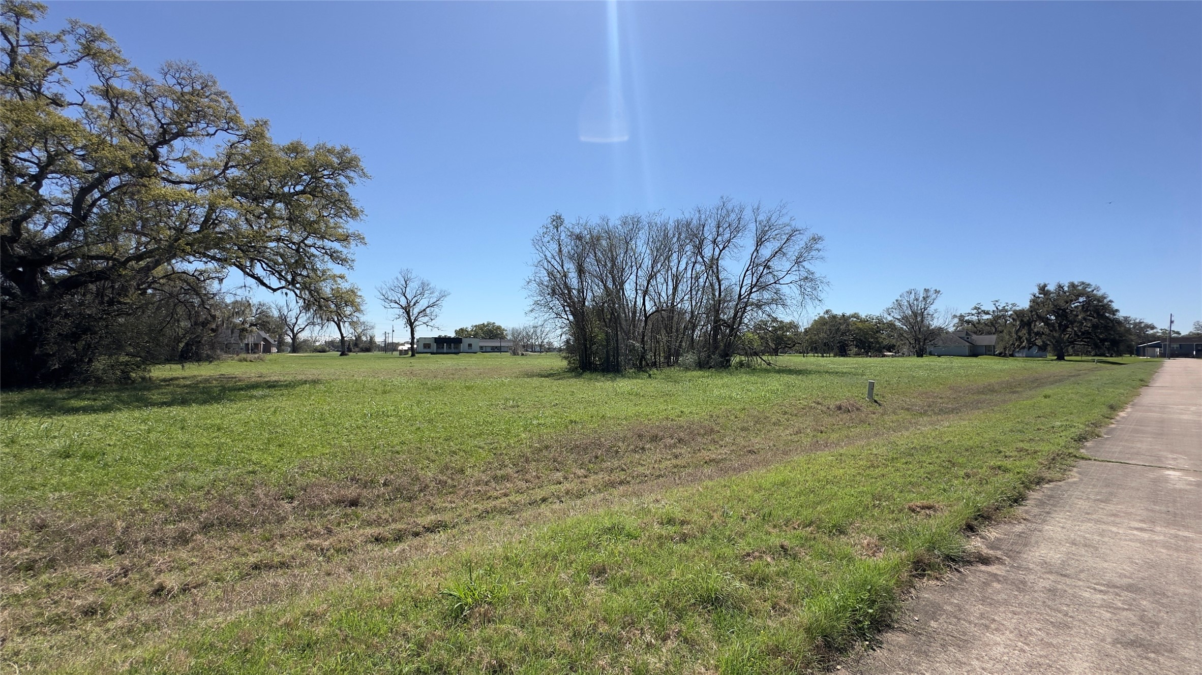 743 Rancho Chico Court Angleton, TX 77515 - Photo 4 of 4 a view of grassy field with trees