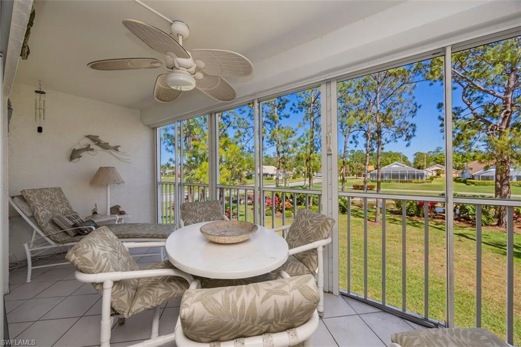 5980 Amherst Drive, Unit D202 Naples, FL 34112 - Photo 11 of 12 Sunroom / solarium with a ceiling fan