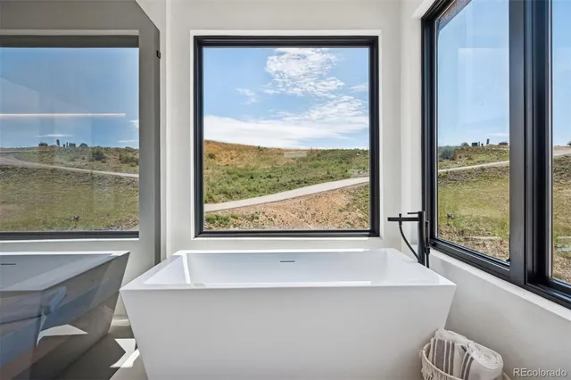 a view of a room with a large window and a table