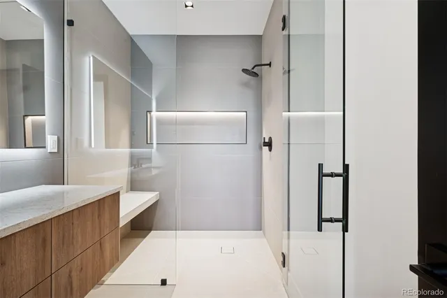 a bathroom with a bathtub and a shower