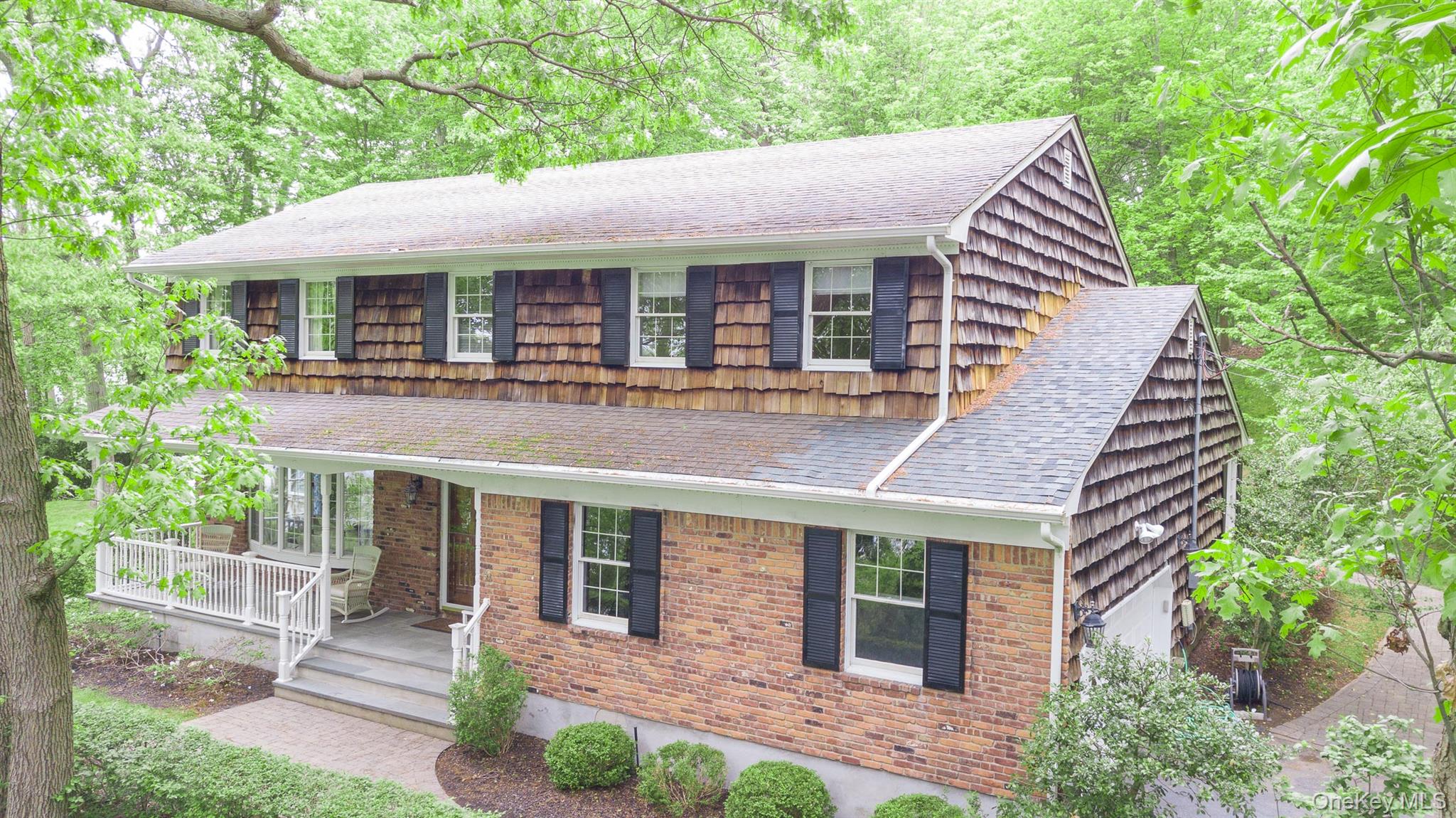 451 River Road Nissequogue, NY 11780 - Photo 1 of 24 a front view of a house with garden