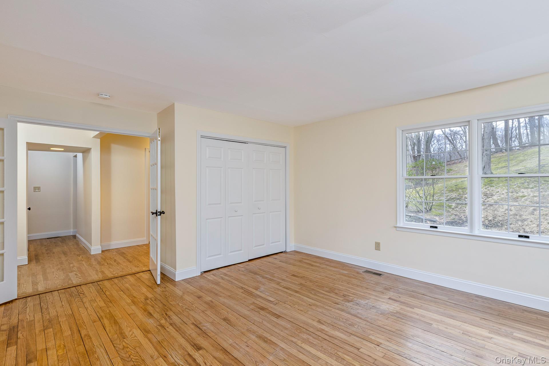 451 River Road Nissequogue, NY 11780 - Photo 14 of 24 a view of empty room with wooden floor and fan