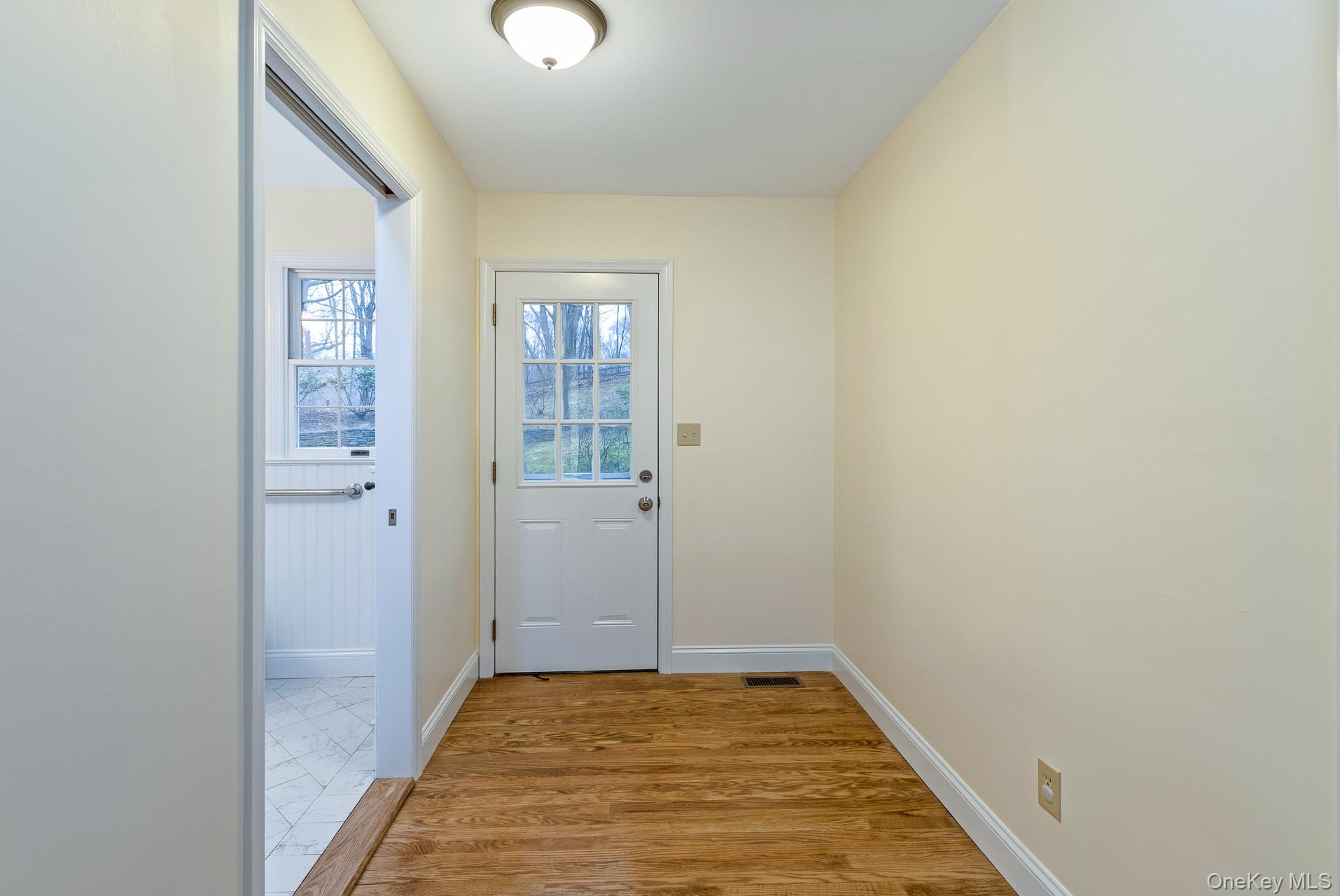 451 River Road Nissequogue, NY 11780 - Photo 16 of 24 a view of a livingroom with wooden floor and a window