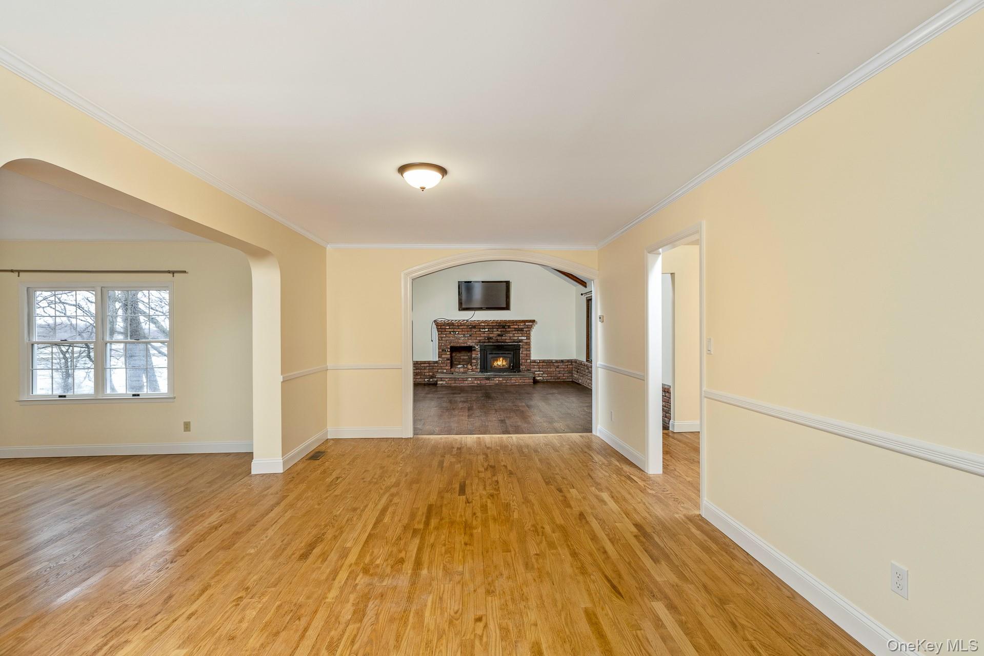 451 River Road Nissequogue, NY 11780 - Photo 8 of 24 a view of a living room hardwood and kitchen with wooden floor