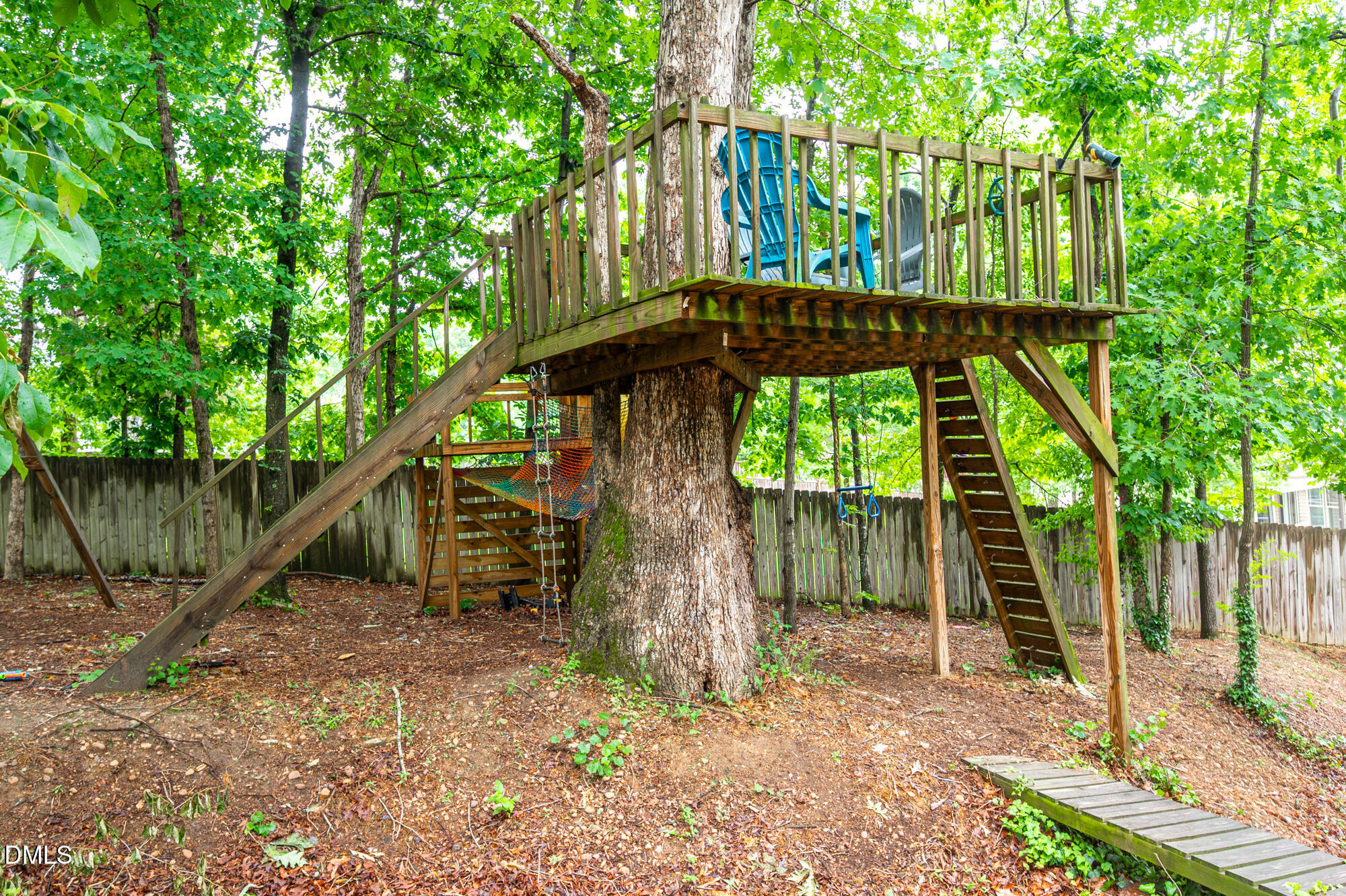 726 Ruth Circle Fuquay-Varina, NC 27526 - Photo 46 of 61 a backyard of a house with plants and tree