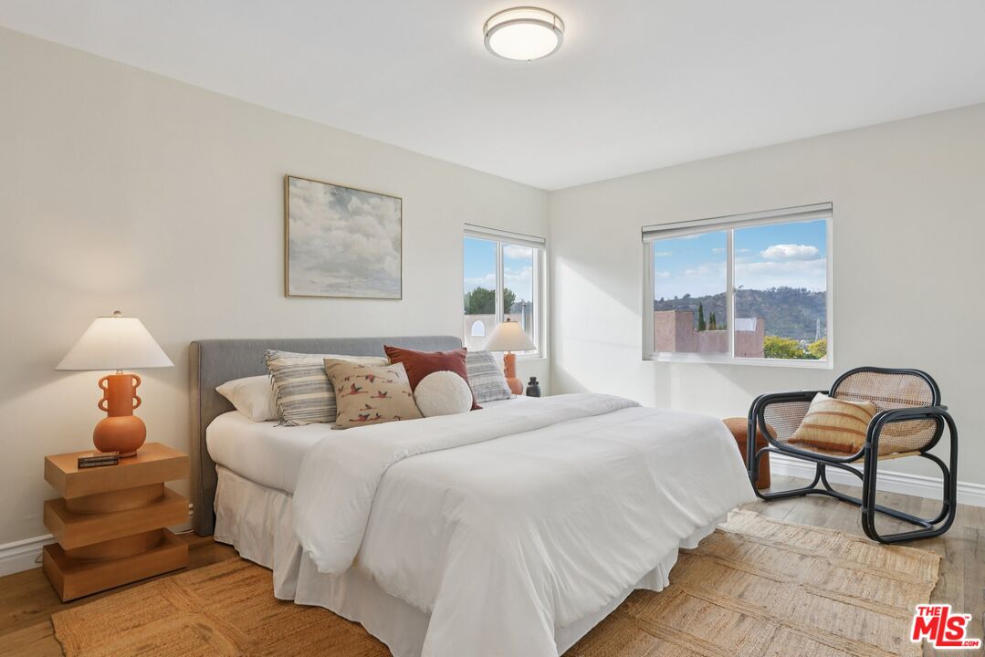 706 Isabel Street Los Angeles, CA 90065 - Photo 11 of 20 a bedroom with a bed and window