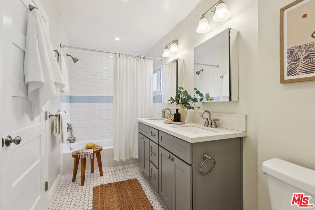 706 Isabel Street Los Angeles, CA 90065 - Photo 13 of 20 a bathroom with a sink a toilet and shower