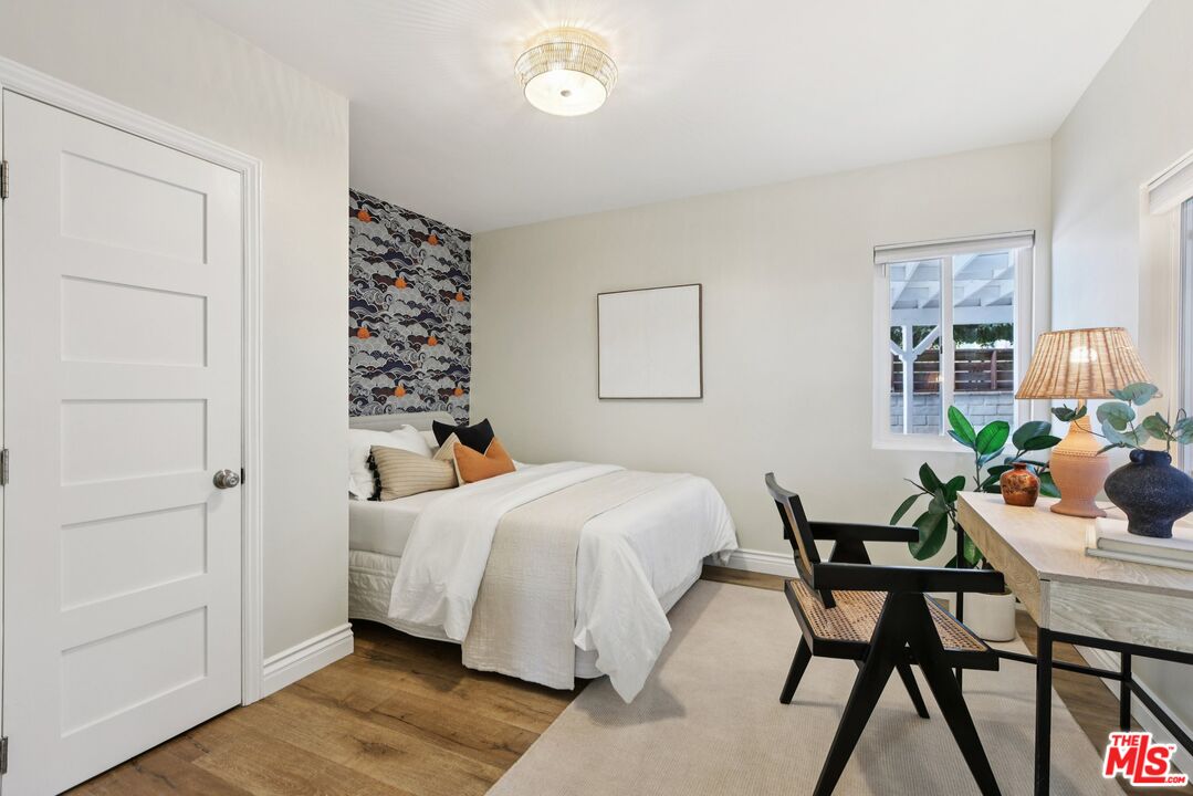 706 Isabel Street Los Angeles, CA 90065 - Photo 15 of 20 a bedroom with a bed and a table in it