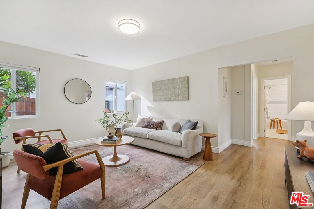 706 Isabel Street Los Angeles, CA 90065 - Photo 5 of 20 a living room with furniture a rug a lamp and a table