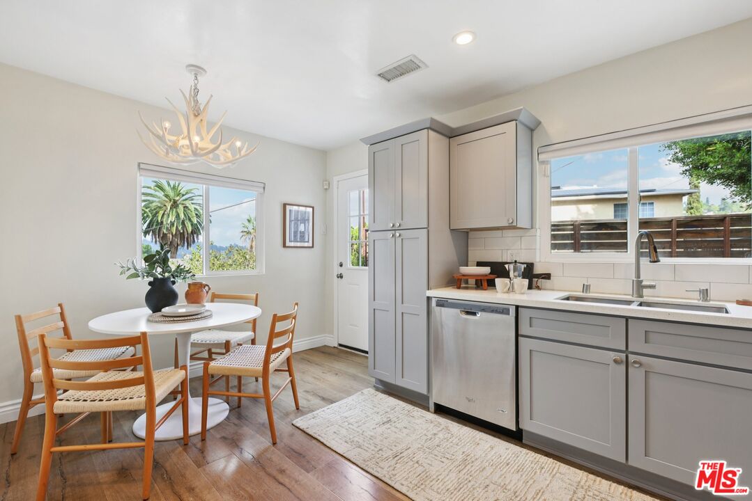 706 Isabel Street Los Angeles, CA 90065 - Photo 6 of 20 a kitchen with sink cabinets and window