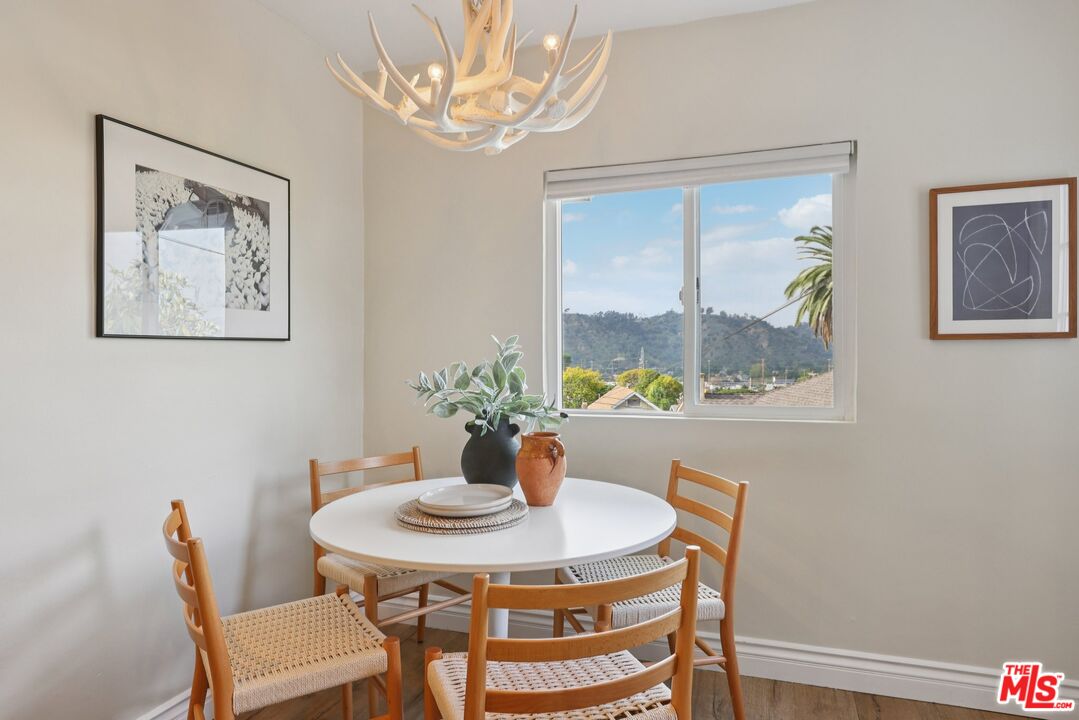 706 Isabel Street Los Angeles, CA 90065 - Photo 8 of 20 a view of a dining room with furniture a chandelier and wooden floor