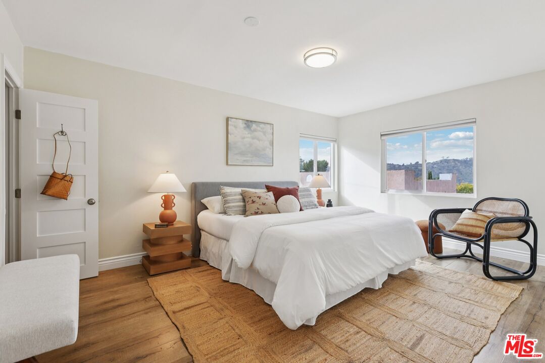 706 Isabel Street Los Angeles, CA 90065 - Photo 10 of 20 a bedroom with a bed and a couch