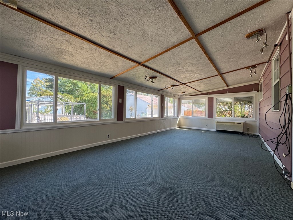 725 Pendley Road Willowick, OH 44095 - Photo 18 of 36 Sunroom with carpet, a textured ceiling, and heat/ac combo