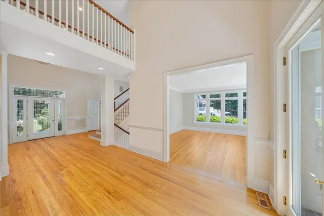 an aerial view of a houses with a lake view