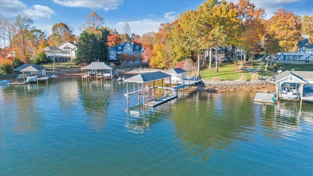 a living room with furniture and a dining table with garden view