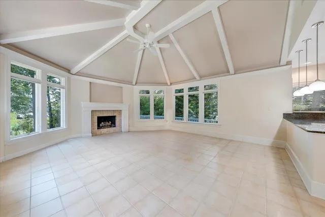 an aerial view of a house with a lake view