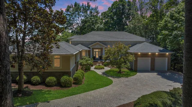 a view of a double vanity sink and a window