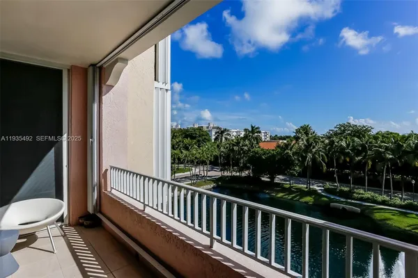 a view of a balcony with wooden floor