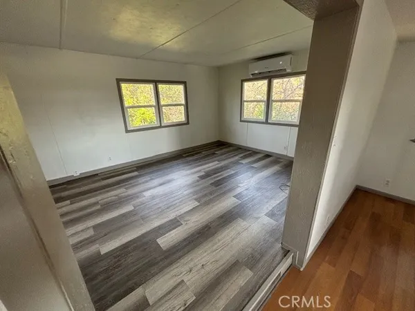 a view of an empty room and a window