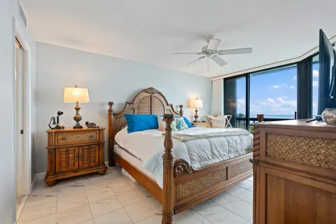 a spacious bedroom with a bed and a dresser