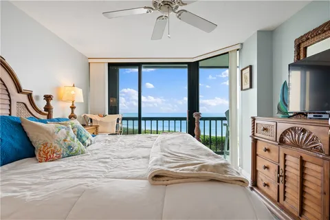 a bedroom with double bed and a window