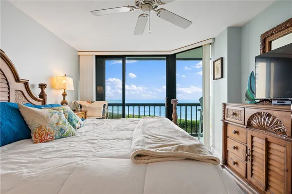 a bedroom with double bed and a window