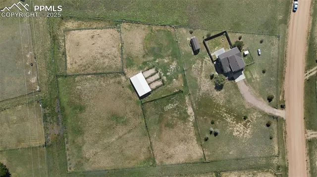 a view of a house with yard in front of house