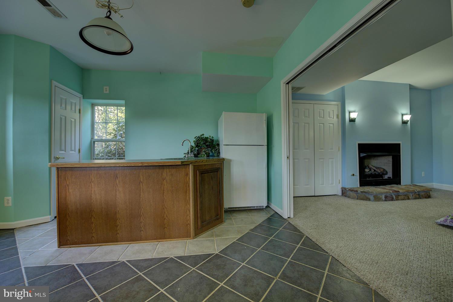 5327 Pond Mountain Road Broad Run, VA 20137 - Photo 26 of 30 Wet Bar and Den with fireplace