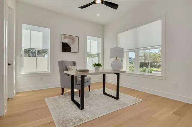 a view of a livingroom with furniture window and wooden floor