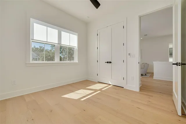 a view of storage and utility room with closet