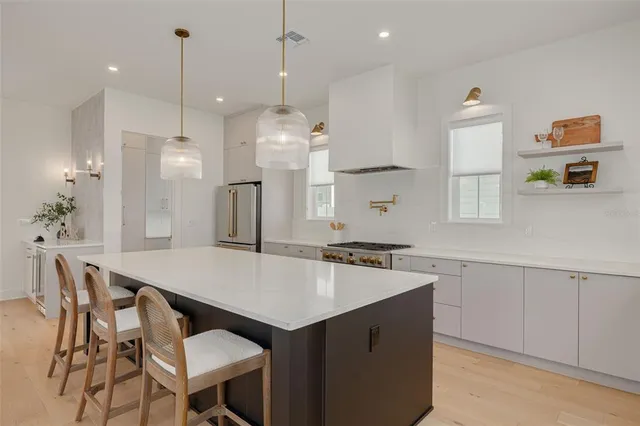 a kitchen with a table and chairs in it