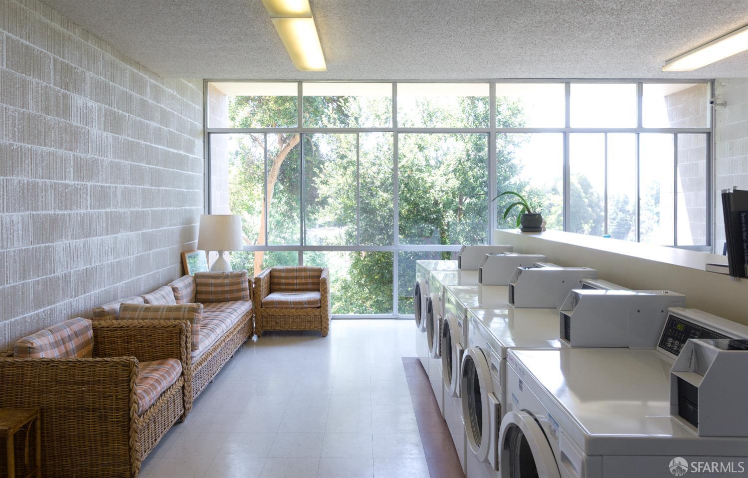 1 Kelton Court, Unit 1E Oakland, CA 94611 - Photo 14 of 23 a living room with furniture and a floor to ceiling window