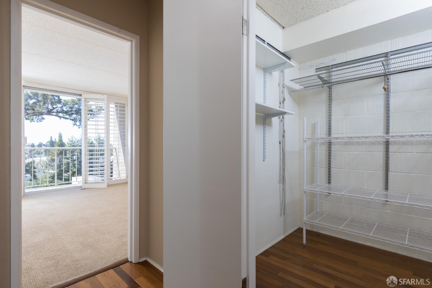 1 Kelton Court, Unit 1E Oakland, CA 94611 - Photo 10 of 23 a view of a room with wooden floor and windows