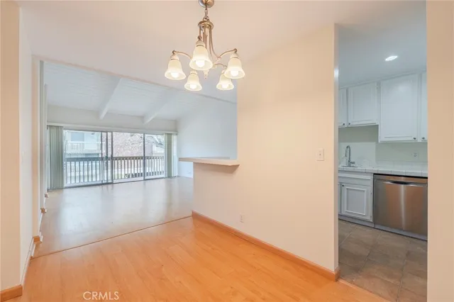 a view of a kitchen with a stove cabinets and a wooden floor