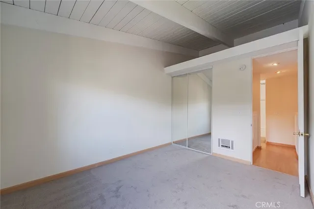 a front view of a building with plants