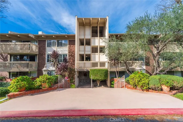 a view of a pathway with a patio