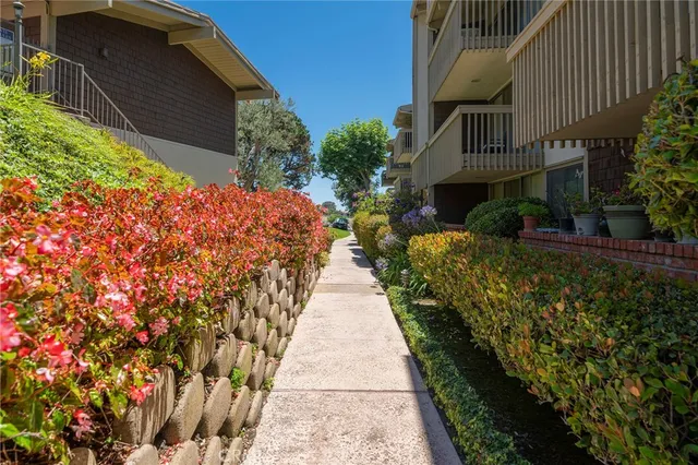 a city street lined with buildings and trees