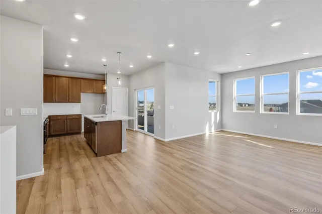 a view of kitchen with cabinets and wooden floor