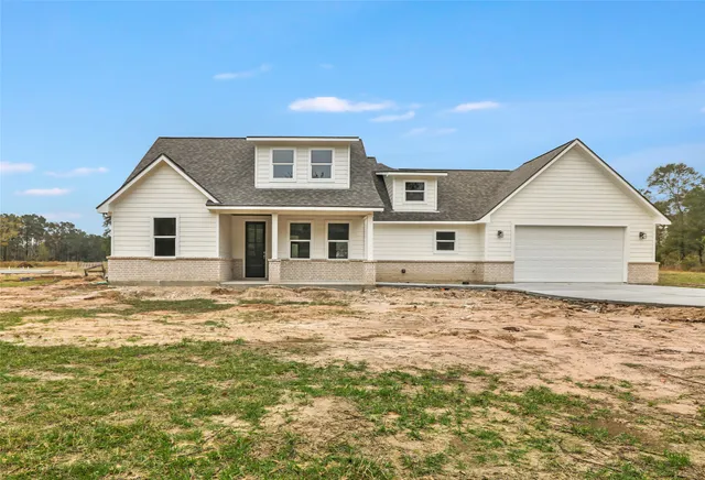 a front view of house with garden