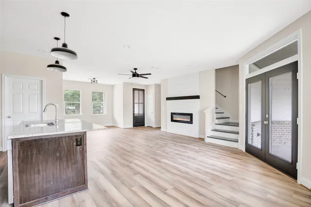 a view of a kitchen with a sink cabinet and a fireplace