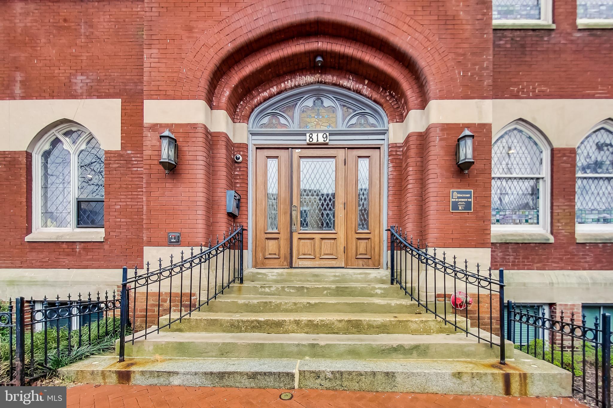 819 D Street Northeast, Unit 7 Washington, DC 20002 - Photo 15 of 20 a view of a brick house with a large windows