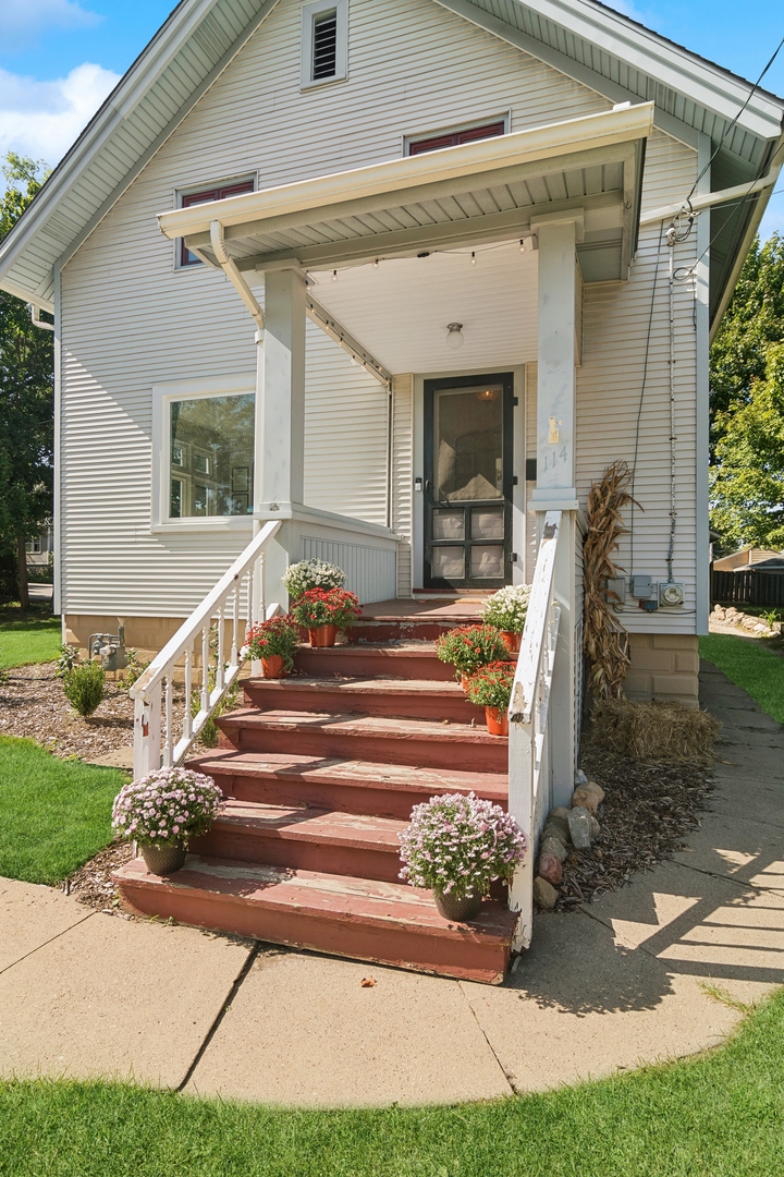 114 Harrison Street Barrington, IL 60010 - Photo 3 of 34 a front view of a house with a porch