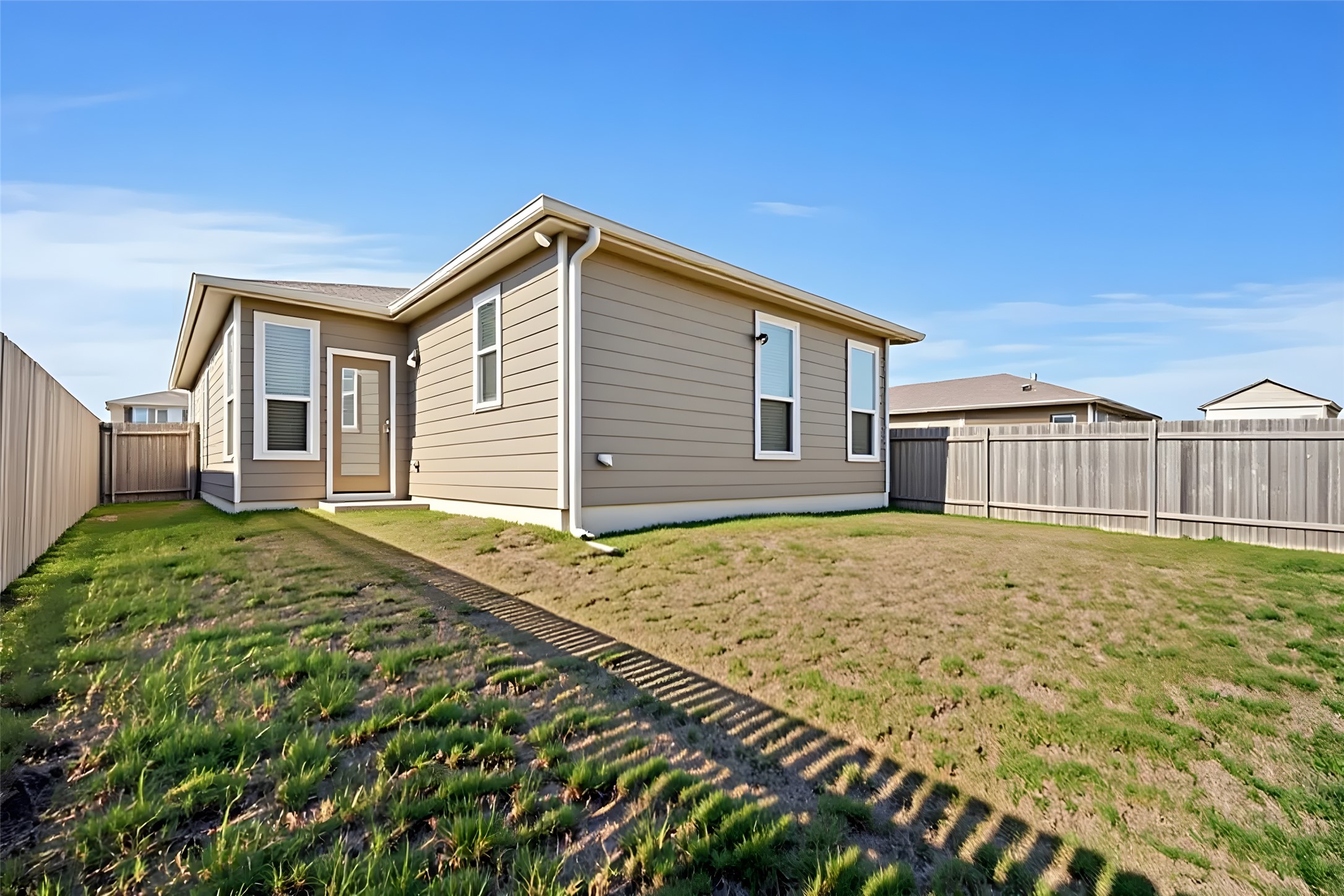 13917 Inaugural Street Manor, TX 78653 - Photo 15 of 39 Rear view of property with a fenced backyard